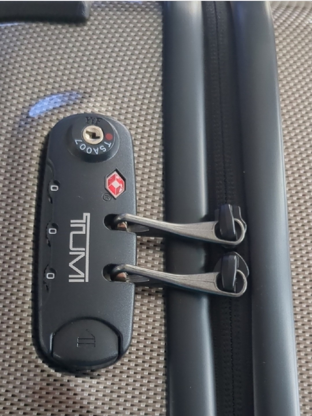 TUMI Hardshell 22" Carry-On Roller in Metallic Tan-Beige. - Picture 7 of 10